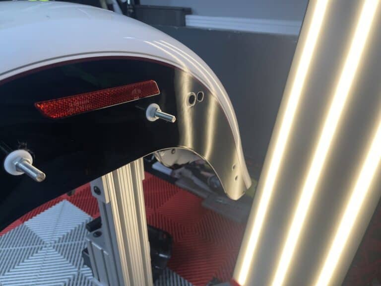 Motorcycle Fender PDR Assessment — RPM Dent Repair Raynham MA Motorcycle rear fender paintless dent repair assessment with PDR light bar at RPM Dent Repair shop Raynham Massachusetts